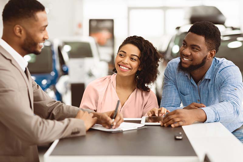 Customer paying for meal at the table using digital wallet on phone through a wireless terminal. 