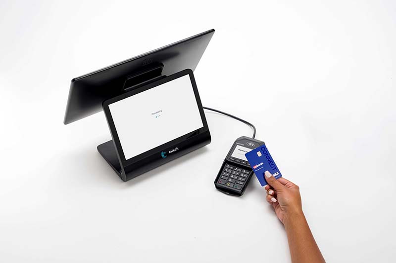 Elavon’s POS terminal on countertop of small business bakery. 