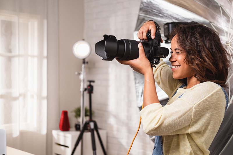 Customer paying for meal at the table using digital wallet on phone through a wireless terminal. 